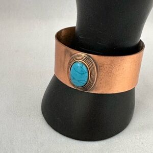 Copper cuff bracelet with faux turquoise stone in center